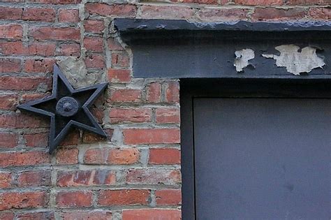 metal star for outside of house meaning|metal stars on old buildings.